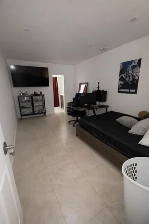 a living room with furniture a rug and a table