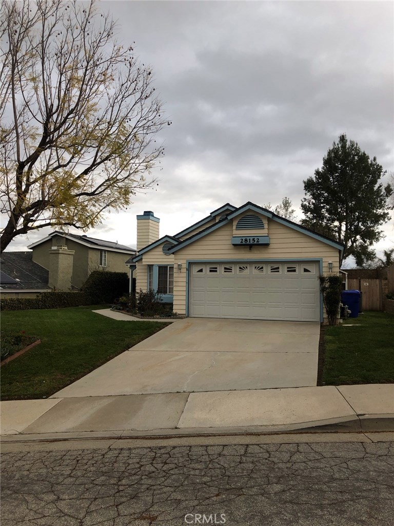28152 Royal Road Castaic, CA 91384 - Photo 1 of 1 a view of house with a yard and large trees