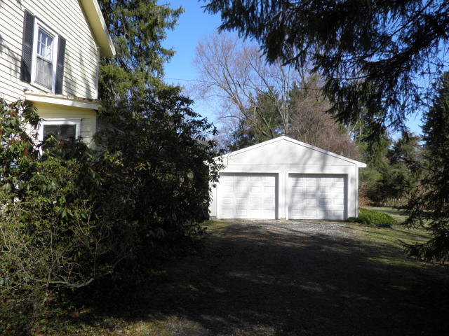 12 Gerdes Road New Canaan, CT 06840 - Photo 4 of 6 a view of a house with a yard