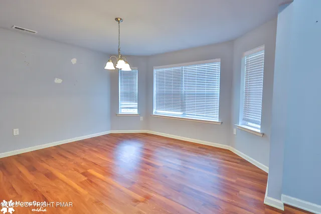 a view of a livingroom with wooden floor