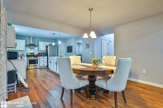 a view of staircase with wooden floor