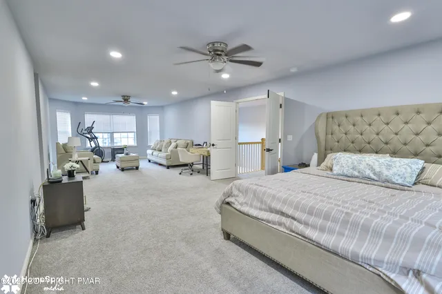 a bed room with a bed and a couch