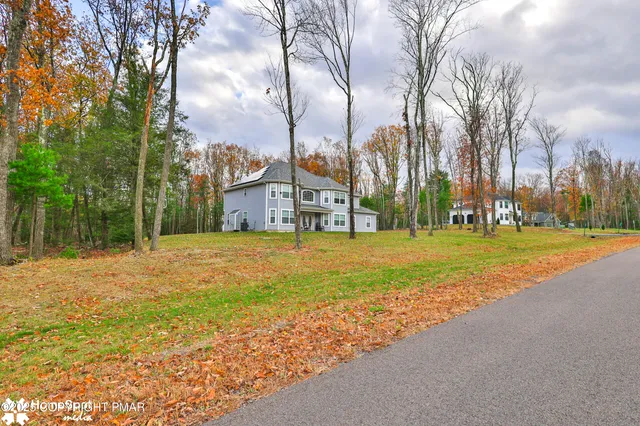 a house with trees in front of it