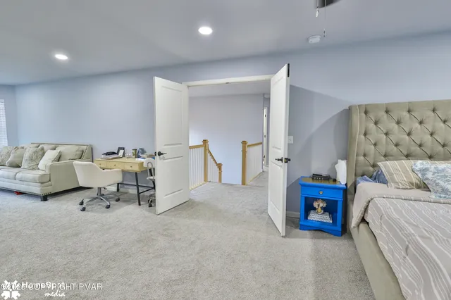 a dining room with furniture and a lamp