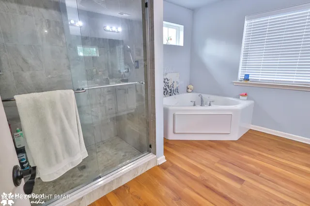 a work room with furniture and a flat screen tv