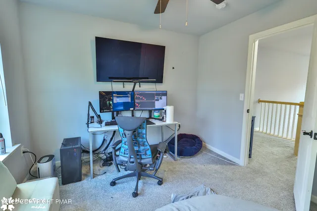 a bathroom with a sink a toilet a mirror a vanity and shower