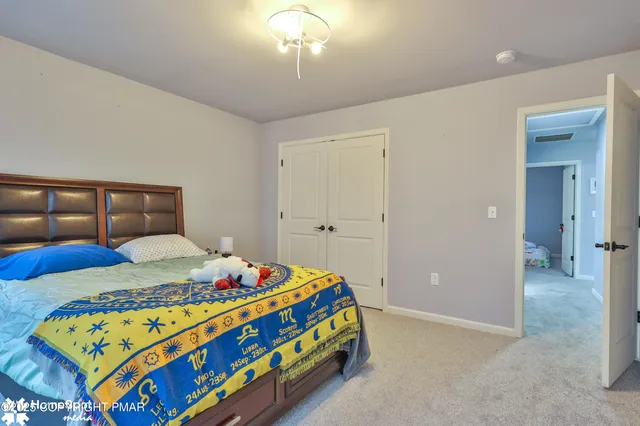 a large house with a big yard and large trees