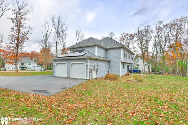 a house view with a sitting space and garden space