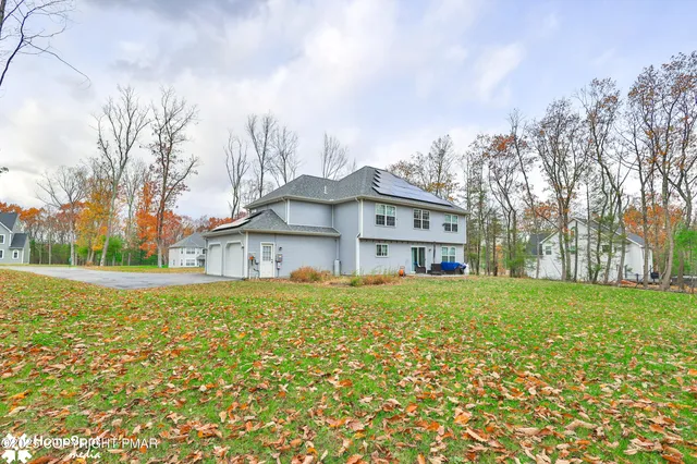 a view of outdoor sitting area with furniture and wooden floor