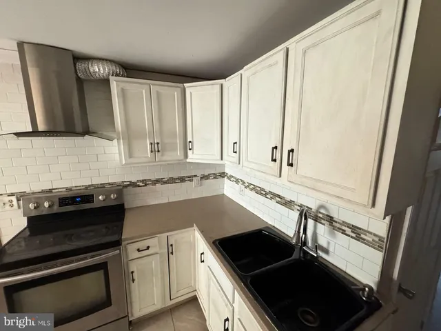 a bathroom with a sink toilet and tub