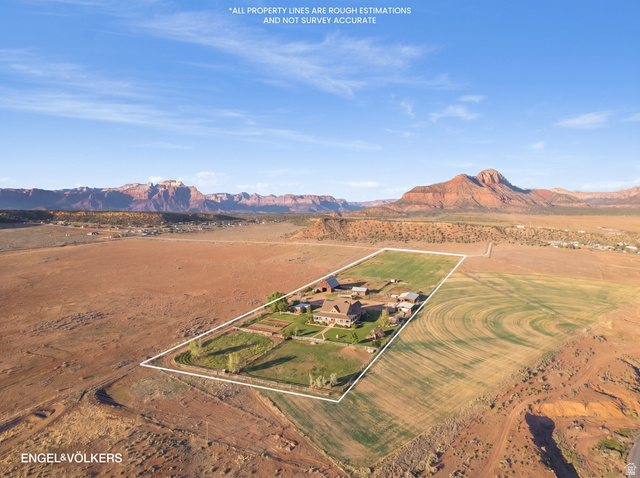 Gooseberry Way Apple Valley, UT 84737 - Photo 17 of 24 Expansive property featuring a central residence, multiple accessory buildings, and cultivated land