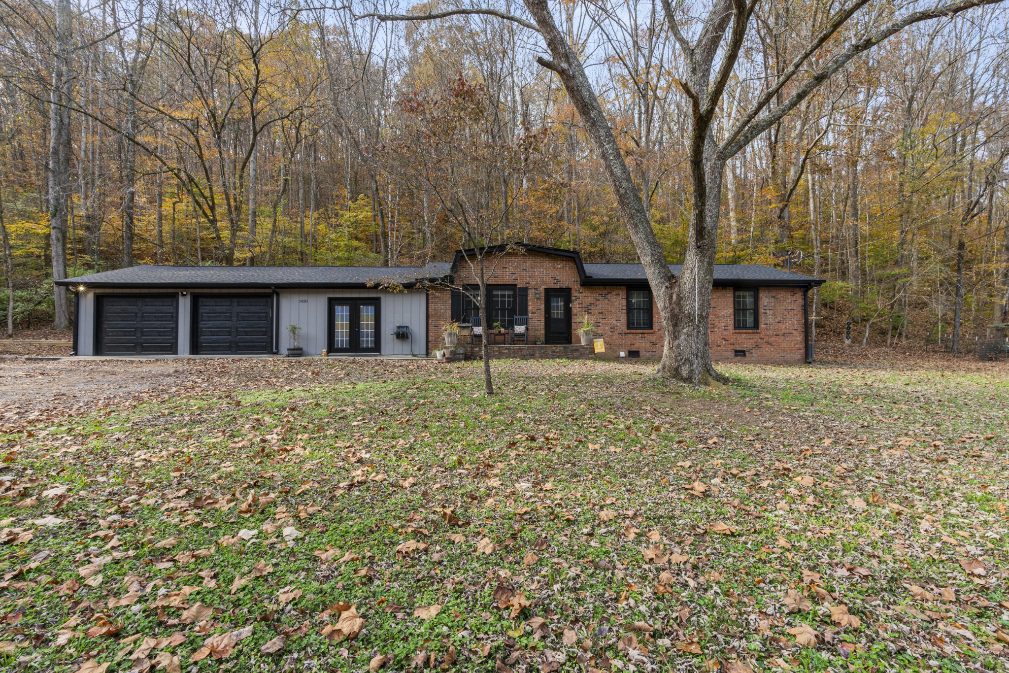 front view of a house with a yard