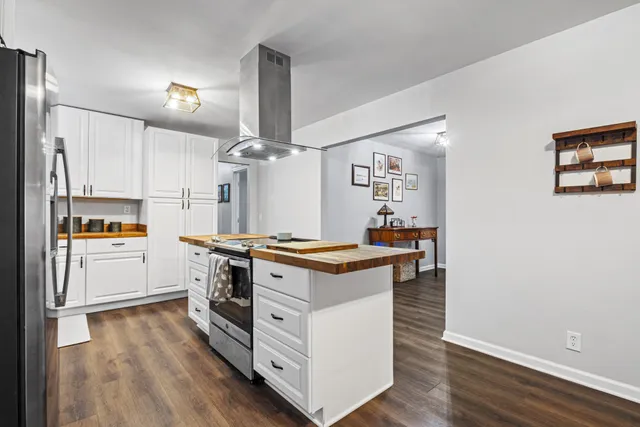 a kitchen with stainless steel appliances a stove and a refrigerator