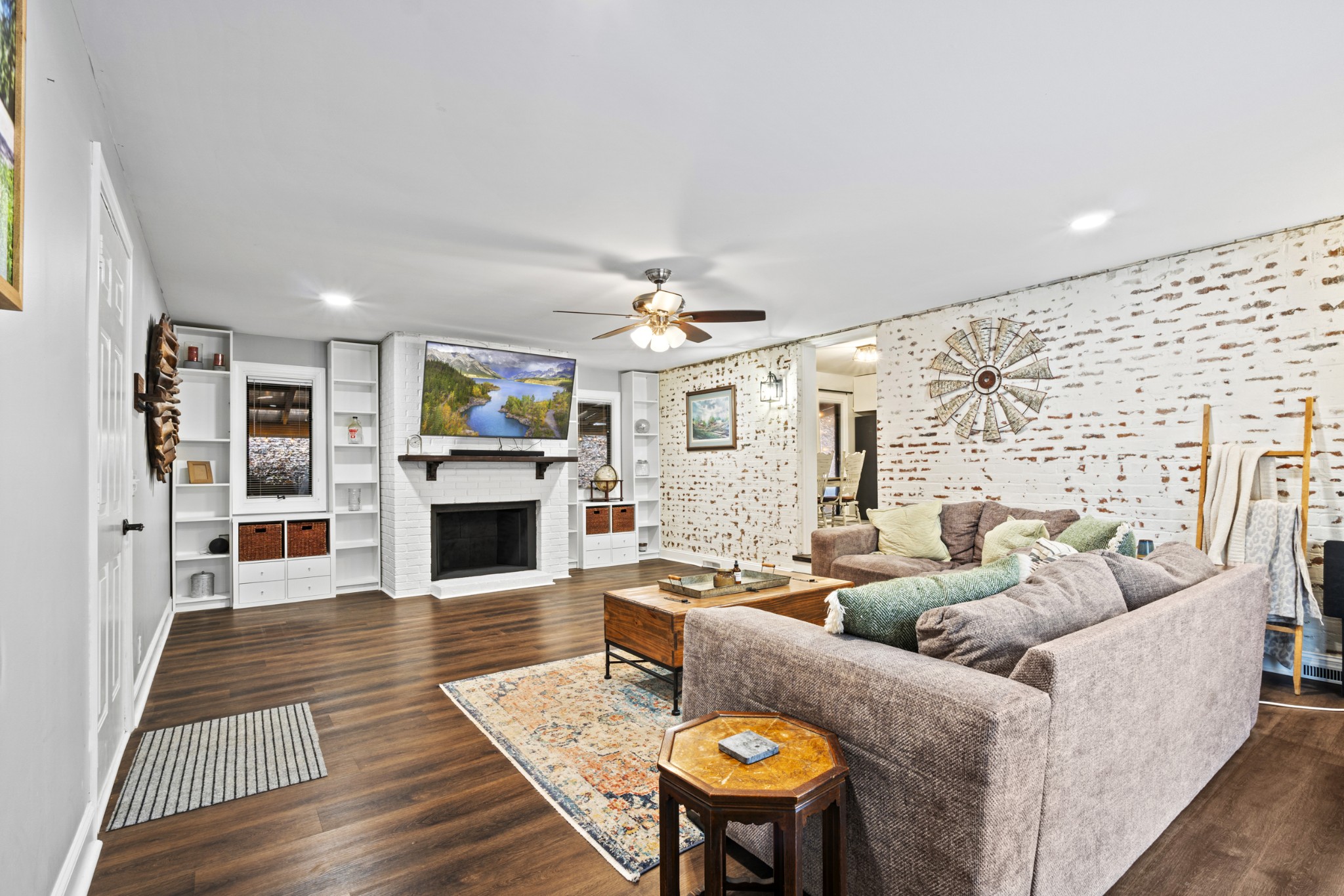 1420 Indian Springs Road Pegram, TN 37143 - Photo 25 of 39 a living room with fireplace furniture and a wooden floor