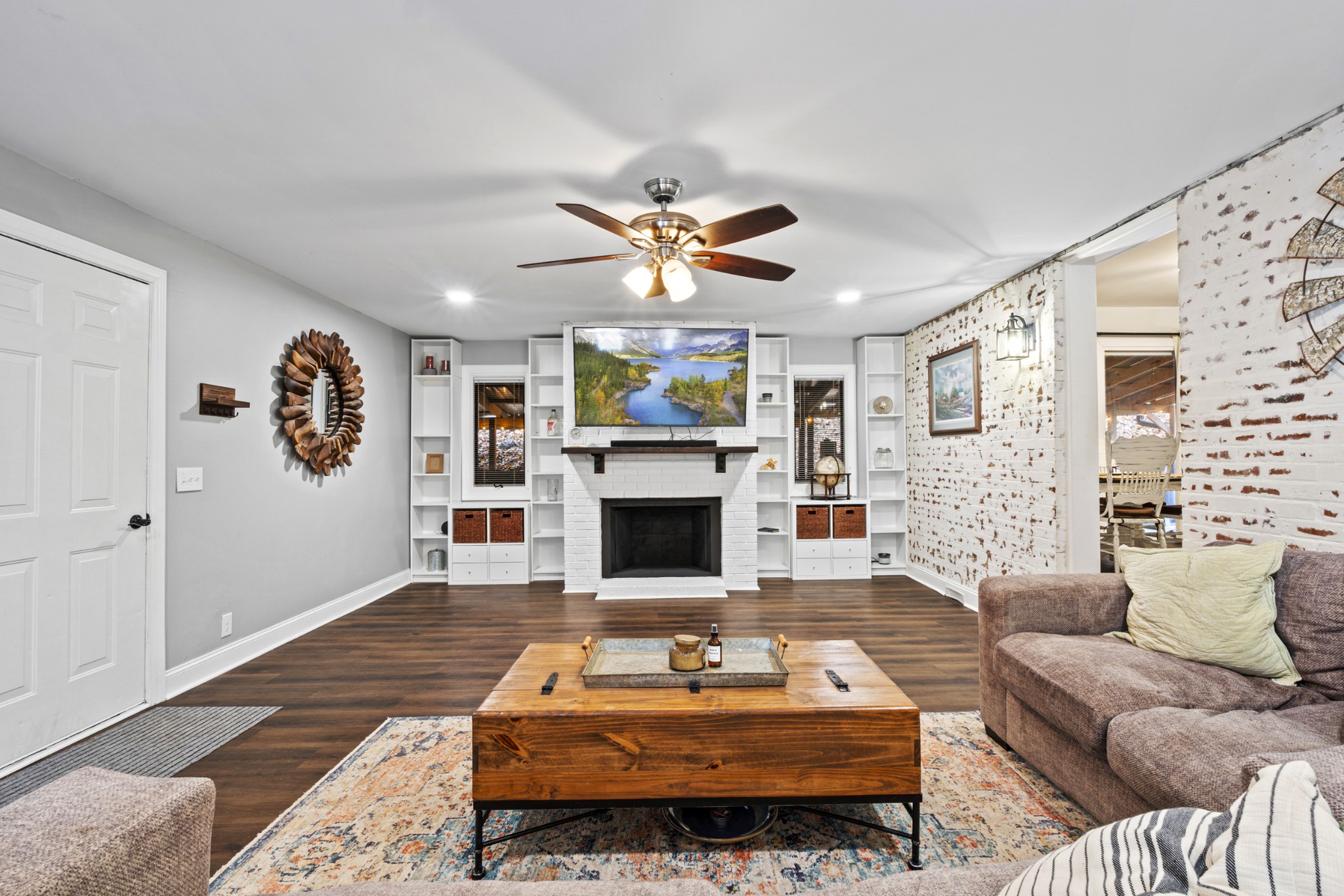 1420 Indian Springs Road Pegram, TN 37143 - Photo 26 of 39 a living room with furniture a fireplace and a flat screen tv