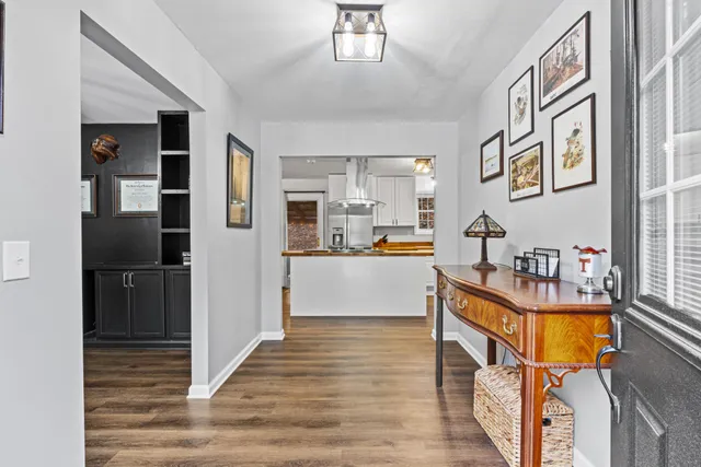 a living room with stainless steel appliances kitchen island granite countertop furniture and a kitchen view