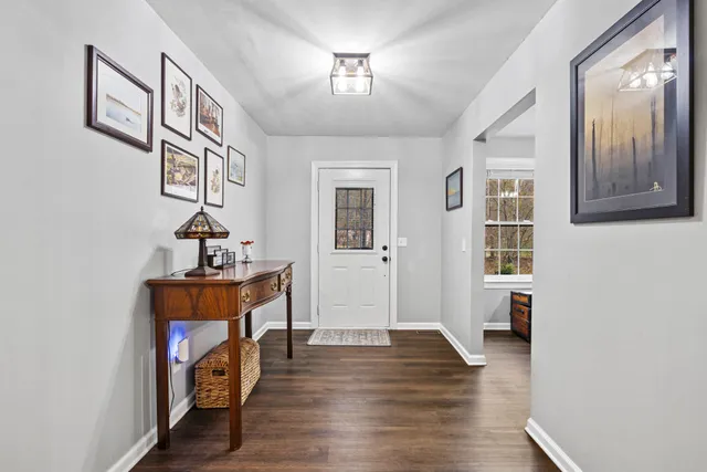 a view of an entryway with wooden floor