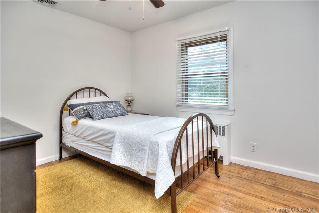 151 Sasapequan Road Fairfield, CT 06824 - Photo 13 of 25 a bedroom with a bed and a window