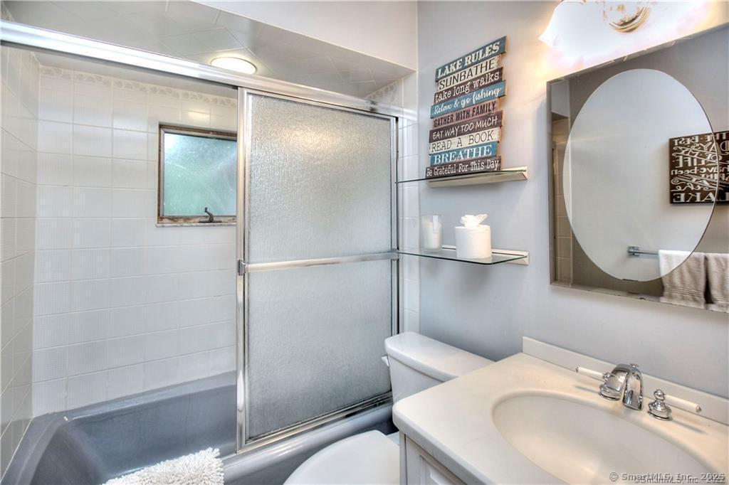 151 Sasapequan Road Fairfield, CT 06824 - Photo 14 of 25 a bathroom with a sink toilet and shower