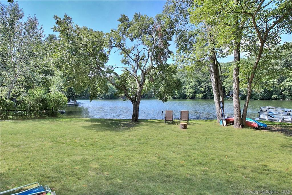 151 Sasapequan Road Fairfield, CT 06824 - Photo 20 of 25 a view of a backyard with large trees