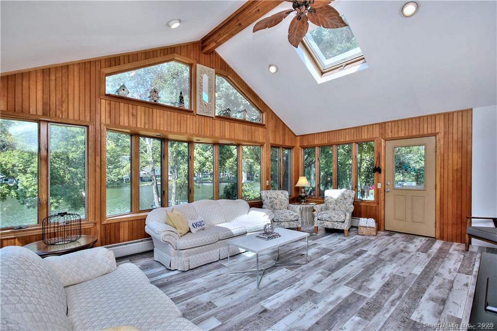 151 Sasapequan Road Fairfield, CT 06824 - Photo 4 of 25 a living room with furniture and a large window