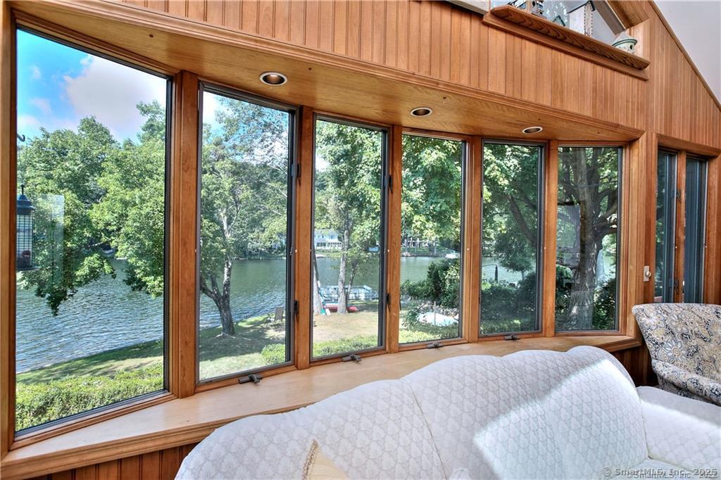 151 Sasapequan Road Fairfield, CT 06824 - Photo 5 of 25 a bedroom with a large window and a bed