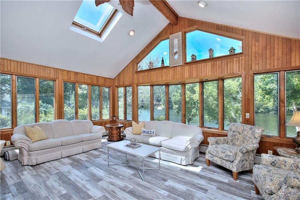 151 Sasapequan Road Fairfield, CT 06824 - Photo 6 of 25 a living room with furniture and large windows