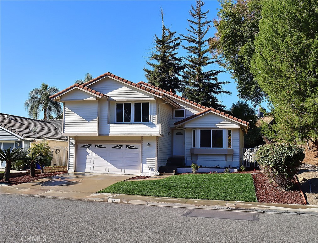 45 Deer Creek Road Pomona, CA 91766 - Photo 1 of 1 a front view of a house with a garden and plants