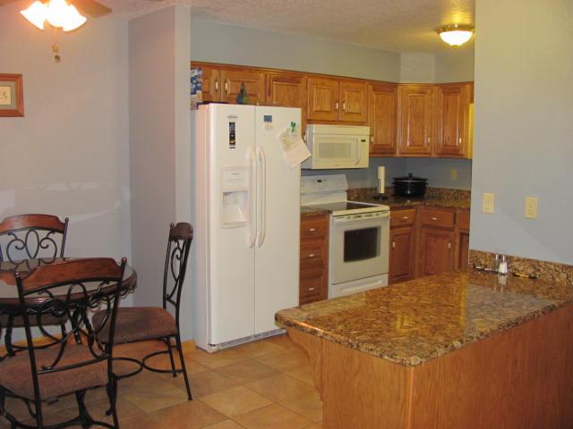 447 R D Prince Road Decherd, TN 37324 - Photo 5 of 20 a kitchen with cabinets and a refrigerator