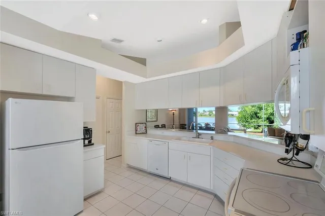 a kitchen with a sink stainless steel appliances and counter space