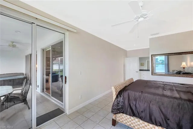 a bedroom with a bed and a mirror