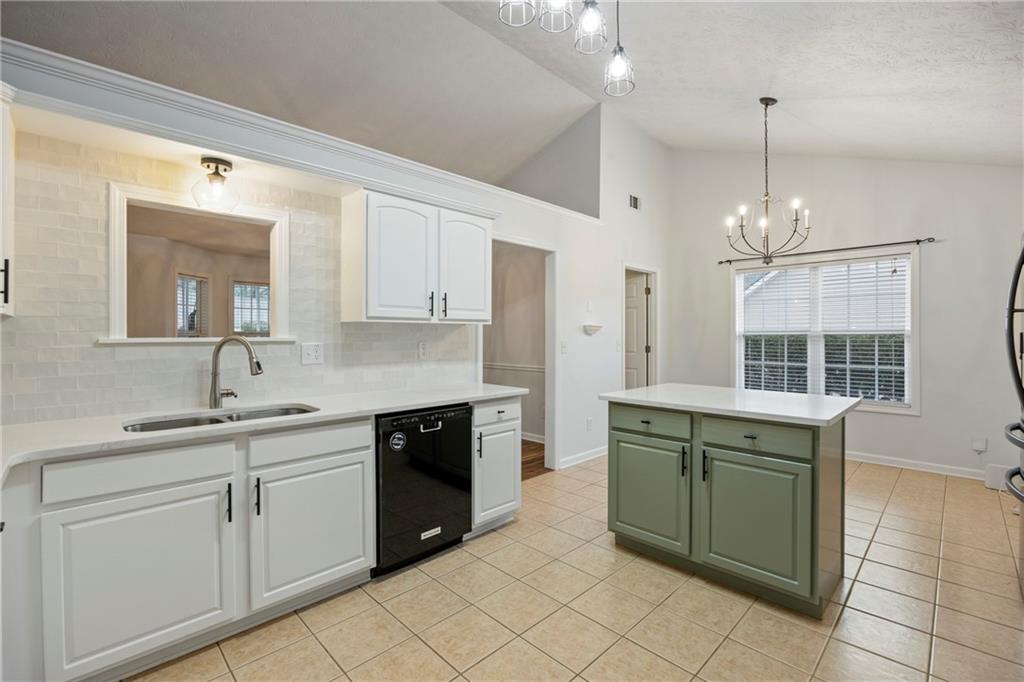3768 North Sharon Church Road Loganville, GA 30052 - Photo 19 of 58 a kitchen with a sink and cabinets