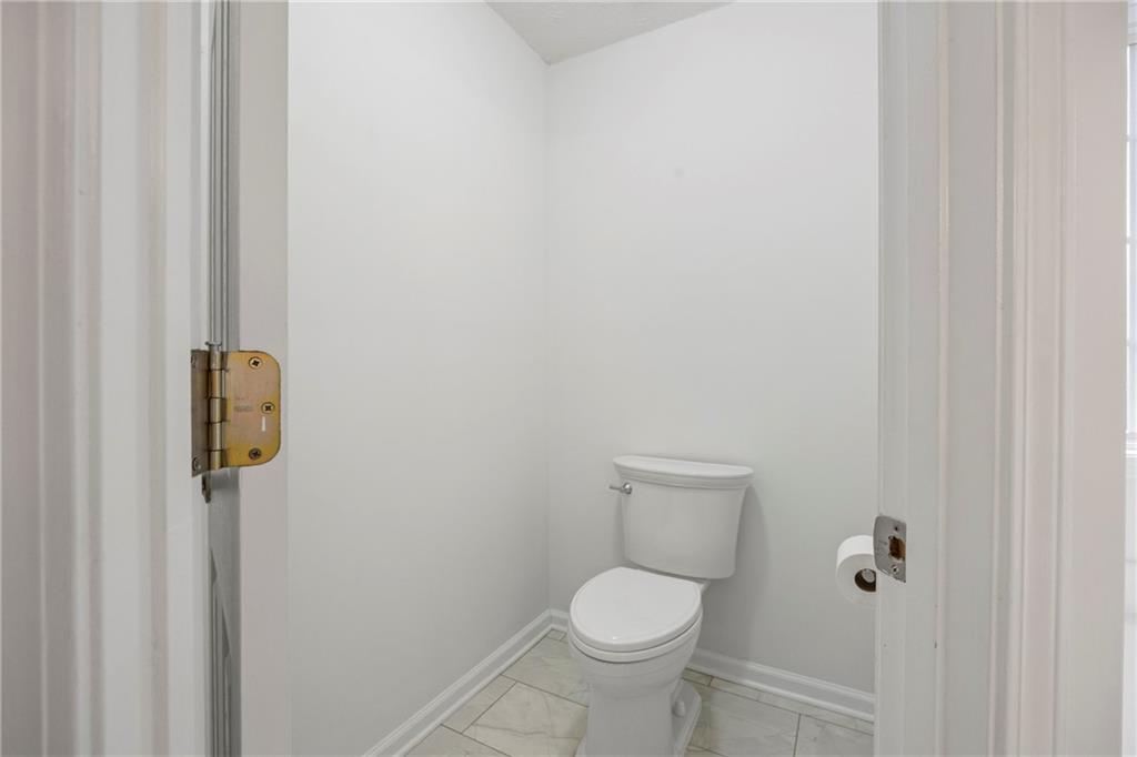 3768 North Sharon Church Road Loganville, GA 30052 - Photo 25 of 58 a white toilet sitting next to a shower