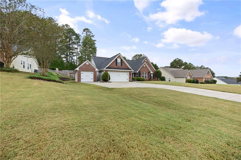 3768 North Sharon Church Road Loganville, GA 30052 - Photo 3 of 58 a view of a large body of water with a building in the background