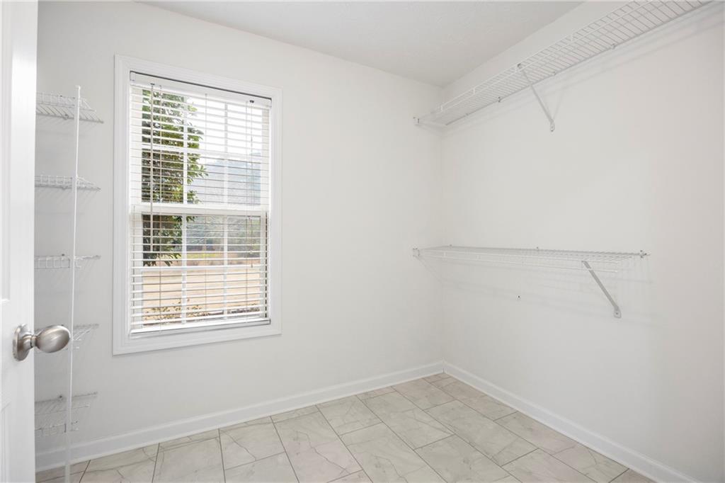 3768 North Sharon Church Road Loganville, GA 30052 - Photo 31 of 58 a view of a room that has a window in it