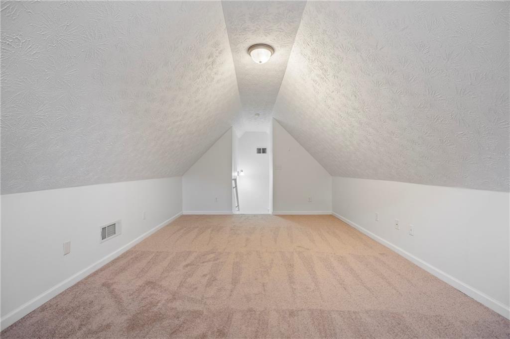 3768 North Sharon Church Road Loganville, GA 30052 - Photo 40 of 58 a view of a big room with closet and windows