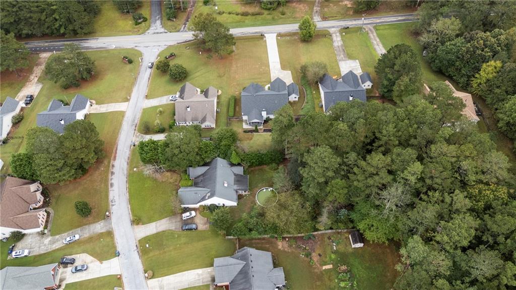 3768 North Sharon Church Road Loganville, GA 30052 - Photo 43 of 58 an aerial view of residential houses with outdoor space and street view