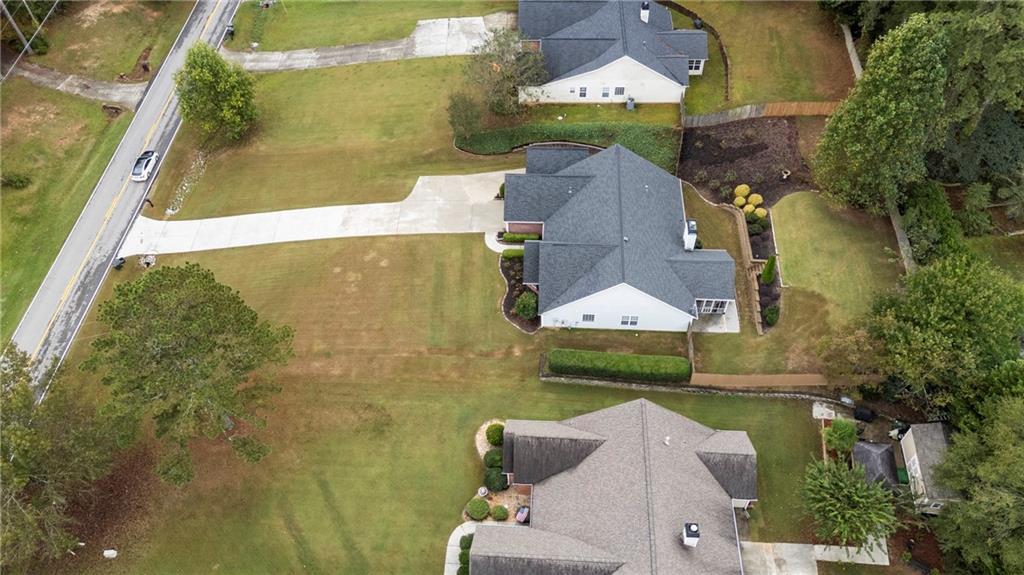 3768 North Sharon Church Road Loganville, GA 30052 - Photo 45 of 58 an aerial view of a house with a garden