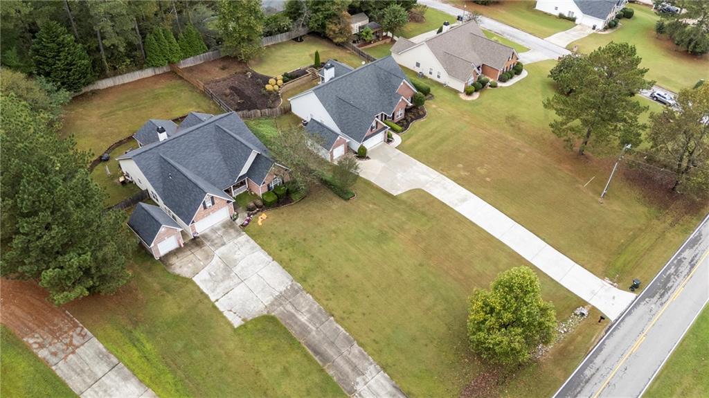 3768 North Sharon Church Road Loganville, GA 30052 - Photo 48 of 58 an aerial view of residential houses with outdoor space