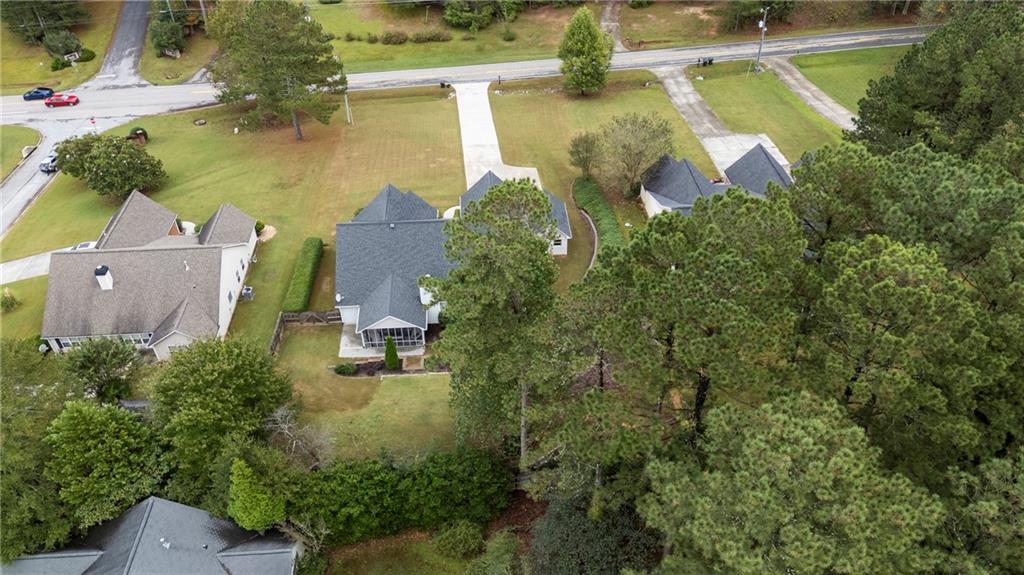3768 North Sharon Church Road Loganville, GA 30052 - Photo 51 of 58 an aerial view of residential houses with outdoor space and swimming pool