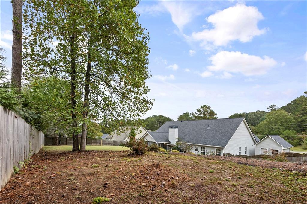 3768 North Sharon Church Road Loganville, GA 30052 - Photo 56 of 58 a view of a house with a yard