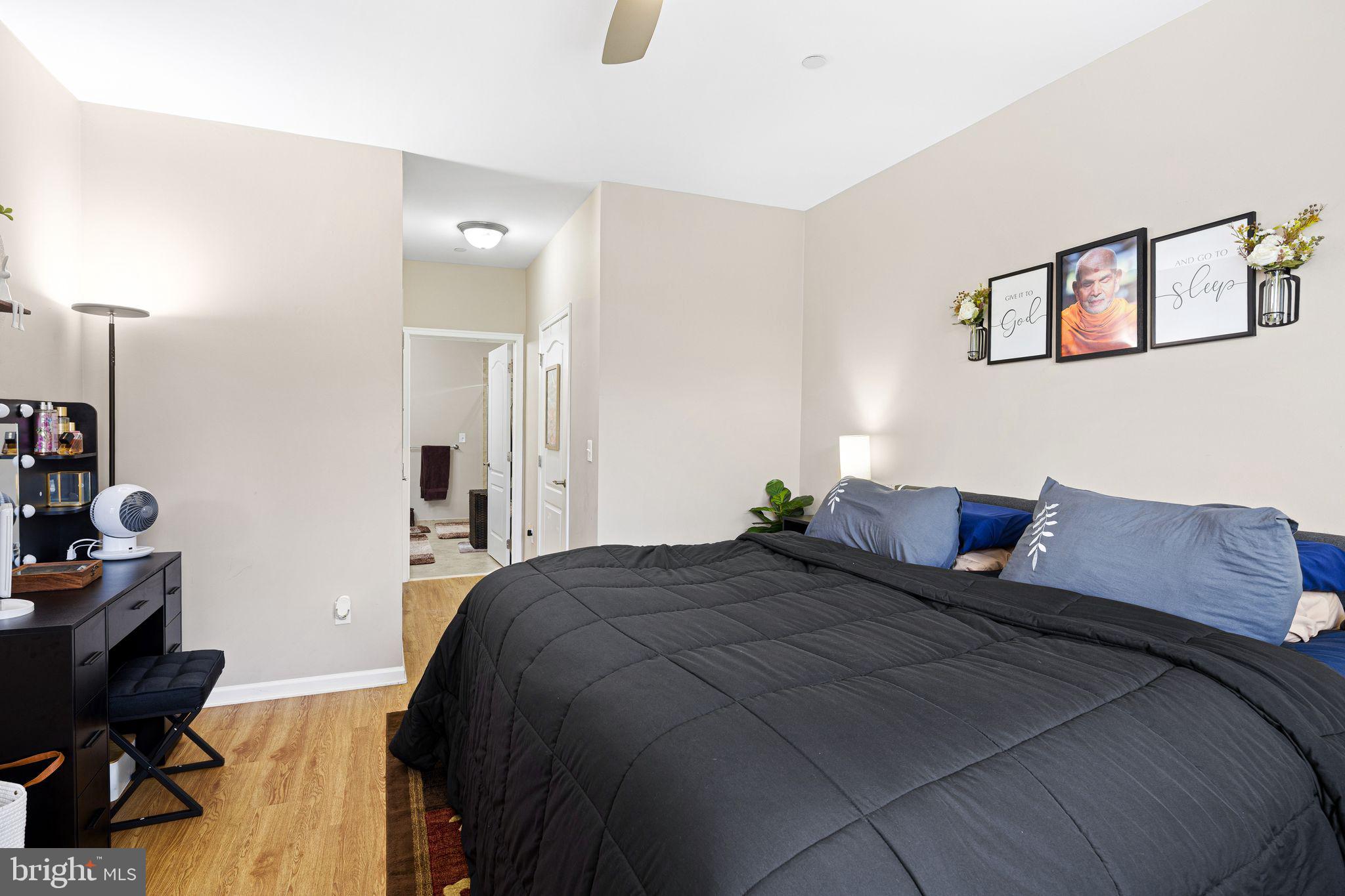 331 Carson Terrace, Unit 331 Huntingdon Valley, PA 19006 - Photo 12 of 15 a bedroom with a bed and a desk