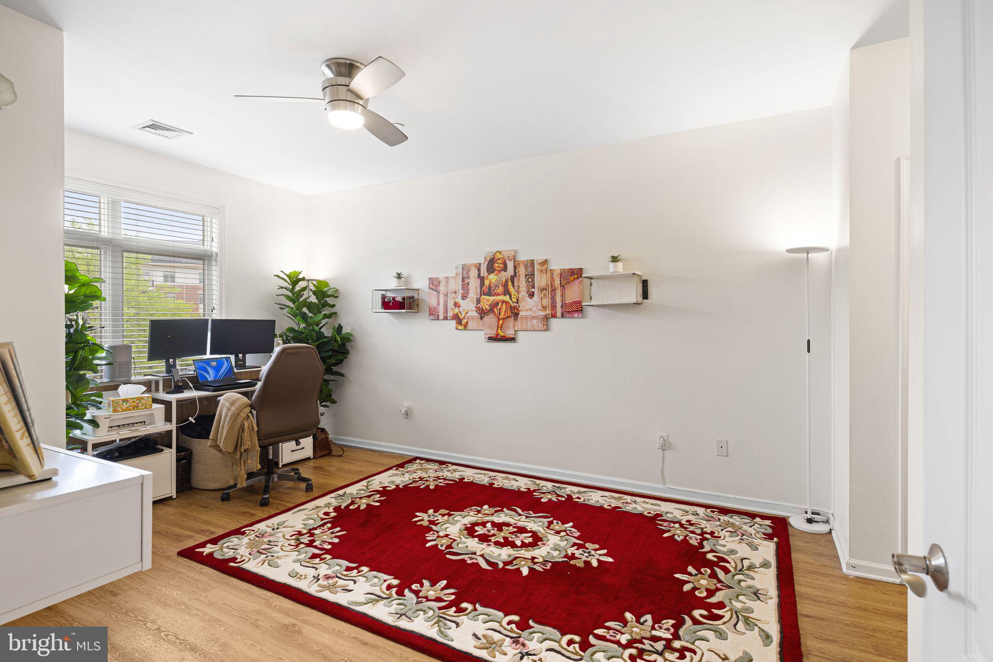 331 Carson Terrace, Unit 331 Huntingdon Valley, PA 19006 - Photo 14 of 15 a living room with furniture and a rug
