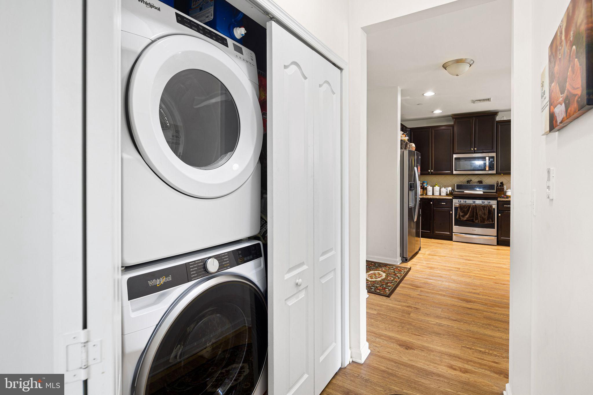 331 Carson Terrace, Unit 331 Huntingdon Valley, PA 19006 - Photo 5 of 15 a view of a hallway with washer and dryer