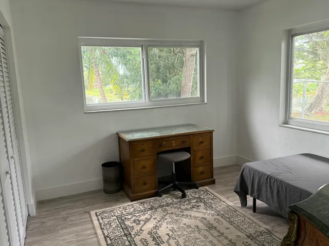 a bathroom with a sink a vanity and a window