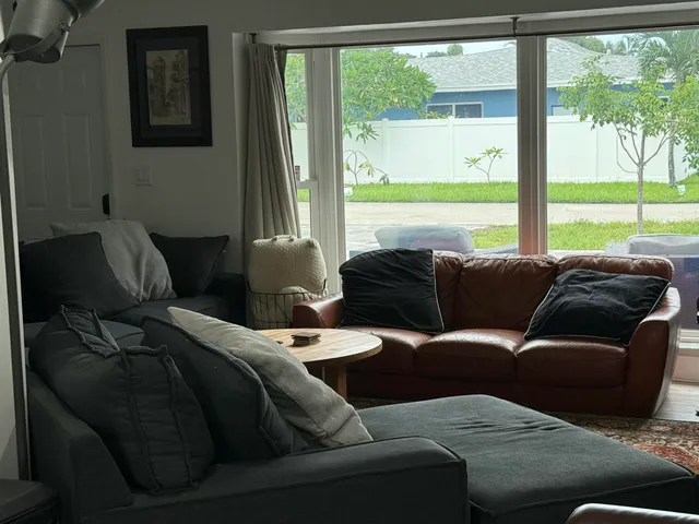 a living room with furniture and a window