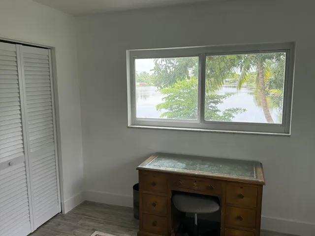 a room with a window and a sink