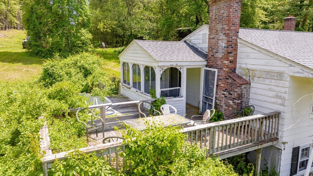 189 Scantic Road Hampden, MA 01036 - Photo 12 of 42 a view of a patio with table and chairs and potted plants