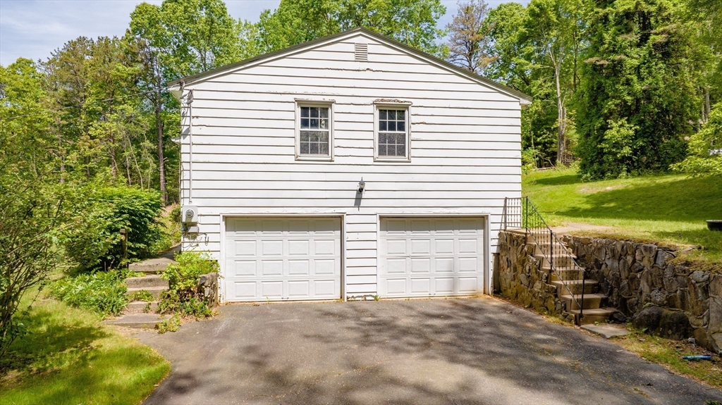 189 Scantic Road Hampden, MA 01036 - Photo 14 of 42 a front view of a house with a yard