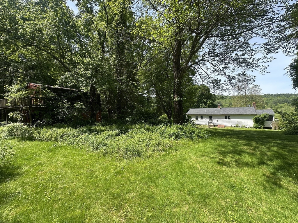 189 Scantic Road Hampden, MA 01036 - Photo 23 of 42 a view of a house with a yard and a large tree